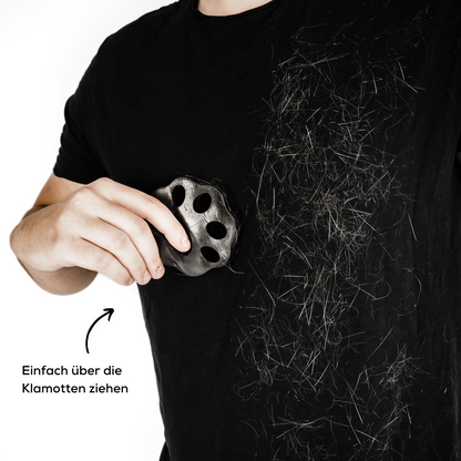 Haarentferner in Form einer schwarzen Pfote zum Klamotten von Tierhaaren enthaaren.