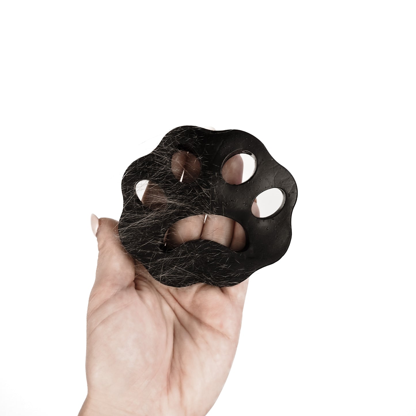 Haarentferner in Form einer schwarzen Pfote zum Klamotten von Katzenhaaren befreien und enthaaren.